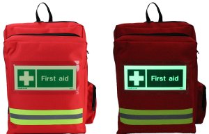 Red first aid rucksack with glow in the dark badge