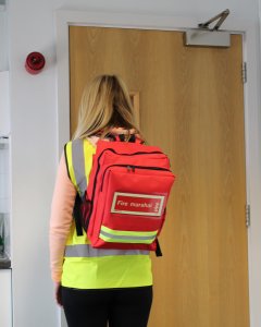 fire marshal rucksack worn while exitign fire exit
