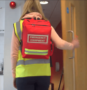 major incident response pack worn by incident controller while looking at exit sign