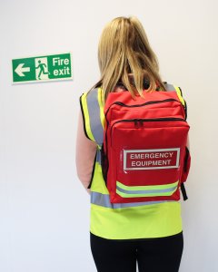 fire warden wearing the fire warden bag while exiting building